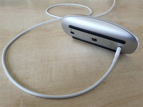 Charging a magic mouse through wireless means